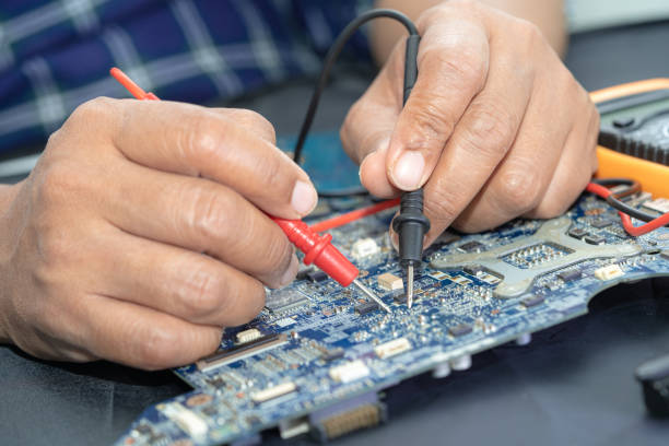 Technician repairing inside of mobile phone. Integrated Circuit. the concept of data, hardware, technology. stock photo