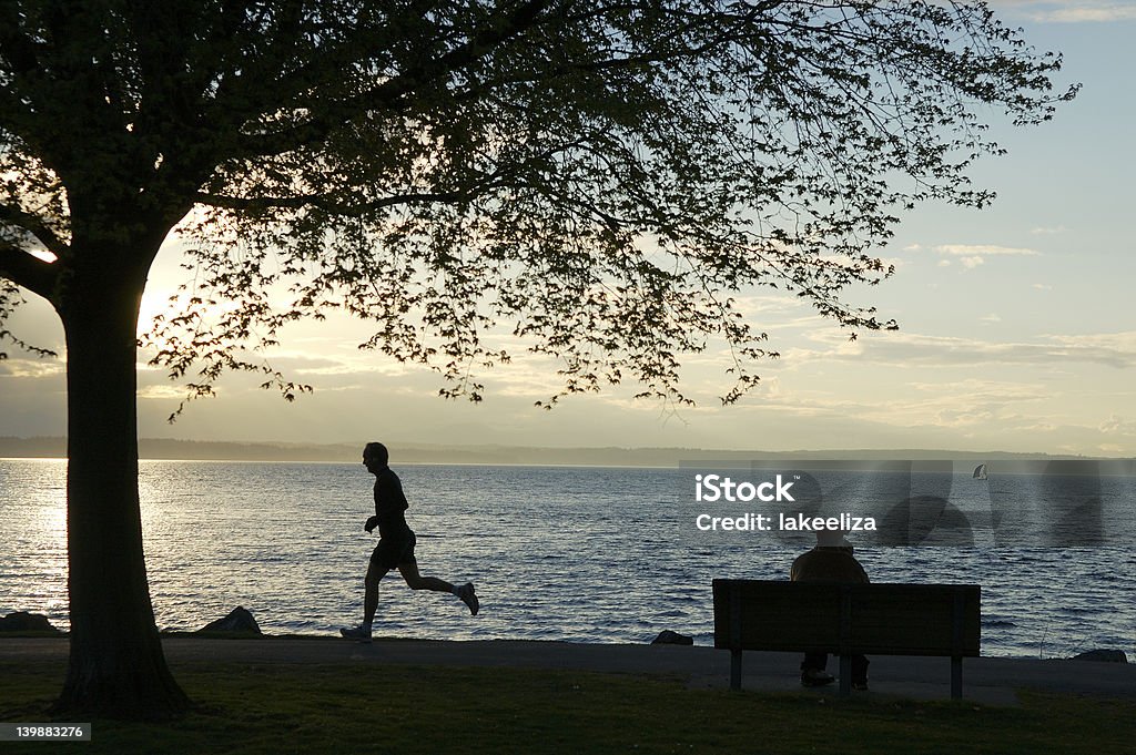 Coureur de la plage de Golden Gardens - Photo de Seattle libre de droits