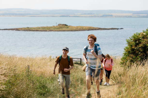 istock Friends at Holy Island Coastline 1398833169