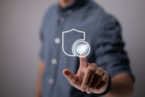 istock Businessman pushing identity proving icon for security protection systems on screen for certified guarantee approval or secure access system idea. Financial investment assurance for businesses. 1398833179