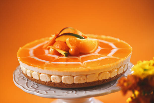 istock Creamy Orange Cheesecake with Whipped Cream 1398833584