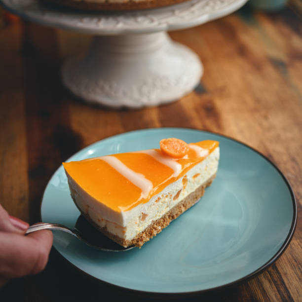 istock Creamy Orange Cheesecake with Whipped Cream 1398833614