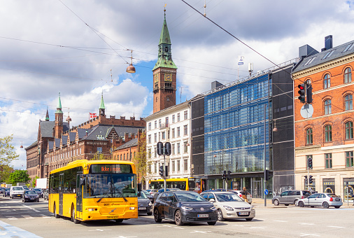 Copenhagen, Denmark - A bus and multiple cars on the street in Copenhagen's city centre during spring.