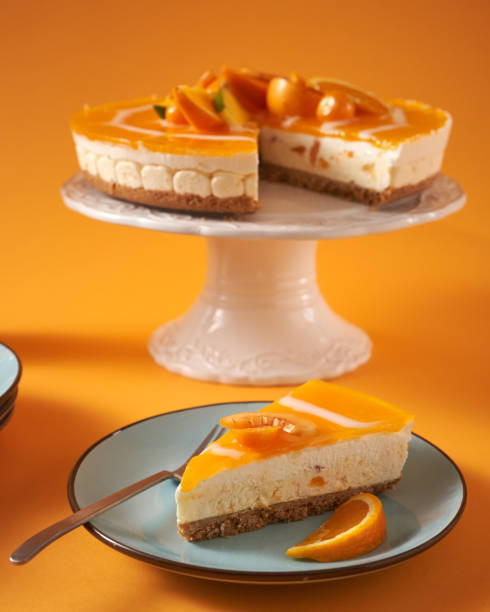 istock Creamy Orange Cheesecake with Whipped Cream 1398834138