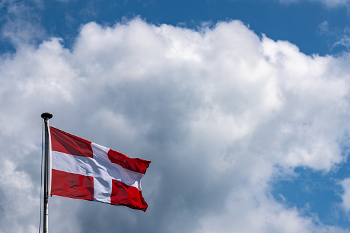 Flag of Switzerland with cloud in background