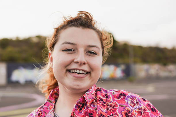 istock Young woman smiling on camera 1398836196