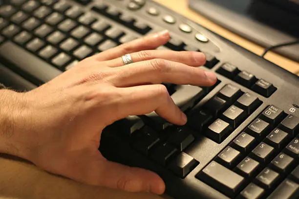 left hand before pressing a key of a computer