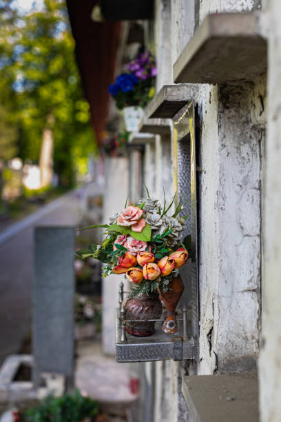 istock a cell in a columbarium next to which lie artificial flowers 1398837742