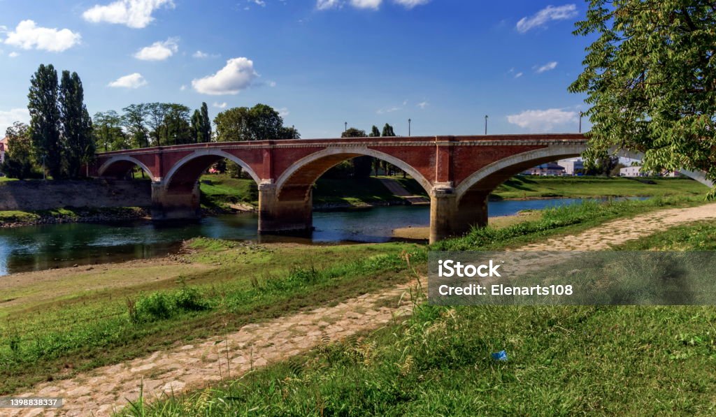 Old bridge over the Kupa river in Sisak, Croatia Old bridge over the Kupa river in Sisak by day, Croatia Arch - Architectural Feature Stock Photo
