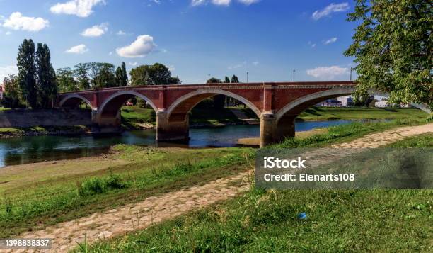 Old Bridge Over The Kupa River In Sisak Croatia Stock Photo - Download Image Now - Arch - Architectural Feature, Architecture, Brick
