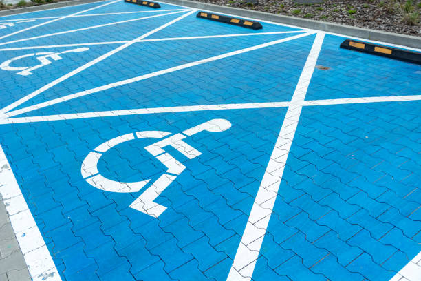 istock Blue car parking spaces for disabled people 1398839412