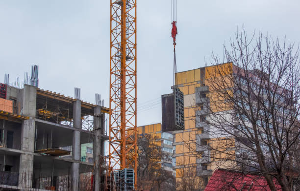 istock A worker prepares formwork for a modern metal-concrete structure of a residential building. 1398840294
