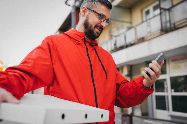istock Young man working in delivery service 1398842289