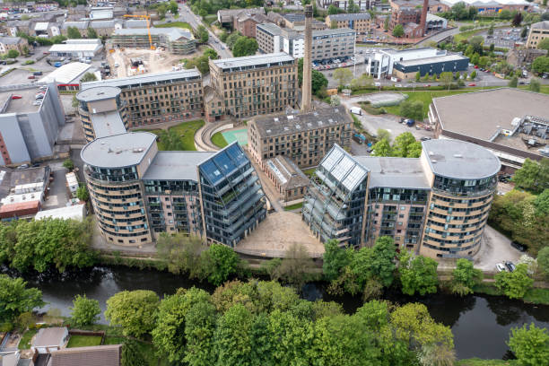 Aerial drone photo of the historic town of Shipley in the City of Bradford, West Yorkshire, England showing a Newley regenerated development of apartment buildings by the by the River Aire stock photo