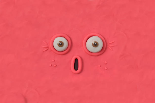 Fabulous creature made by hand from pink plasticine. Scary face of alien monster. 3d artwork