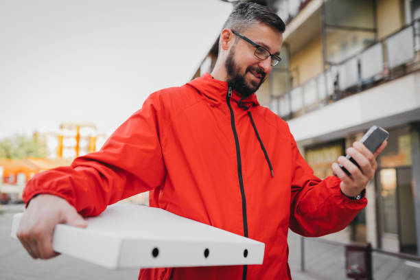 istock Young man working in delivery service 1398842577