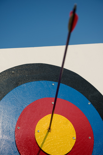 Arrow in the center of target for archery, closeup. High quality photo