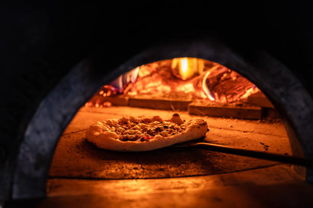 istock Pizza oven burning in flames getting ready to bake pizza 1398844289