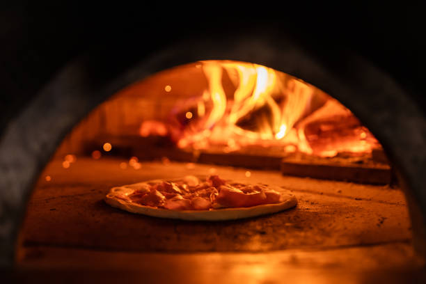 istock Pizza oven burning in flames getting ready to bake pizza 1398844317