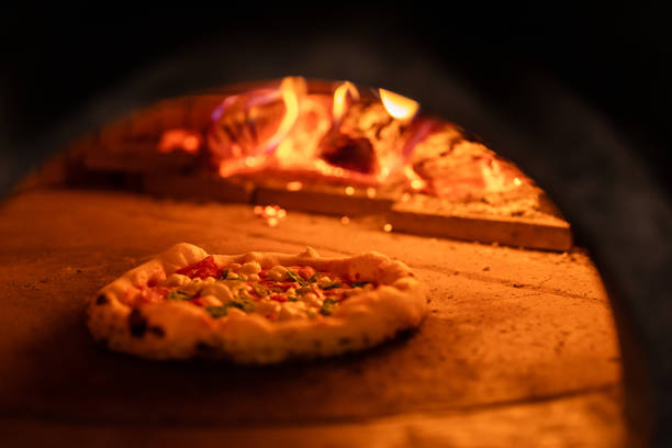 istock Pizza oven burning in flames getting ready to bake pizza 1398844328
