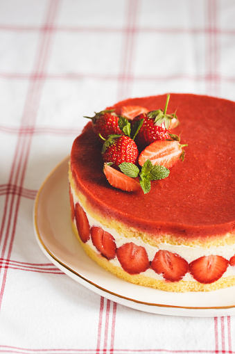 French strawberry cake Fraisier on white plate.