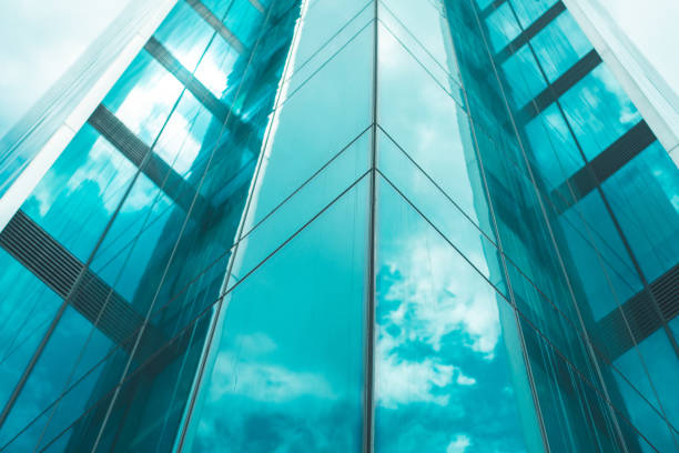 istock underside panoramic and perspective view to steel blue glass high rise building skyscrapers 1398845521