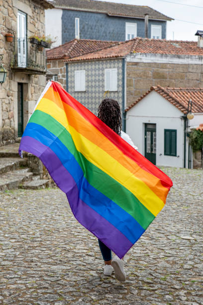 istock young woman with lgtb rainbow flag 1398845692