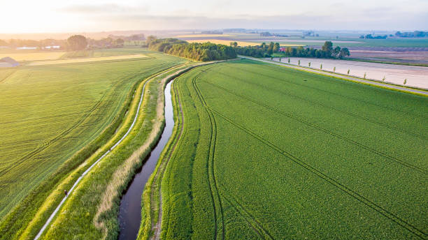istock Small canal going through farm lands 1398846667