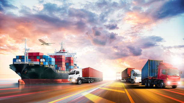 istock Logistics import export of containers cargo freight ship, truck transport with red container on highway at port cargo shipping dock yard background, copy space, plane, transportation industry concept 1398847433