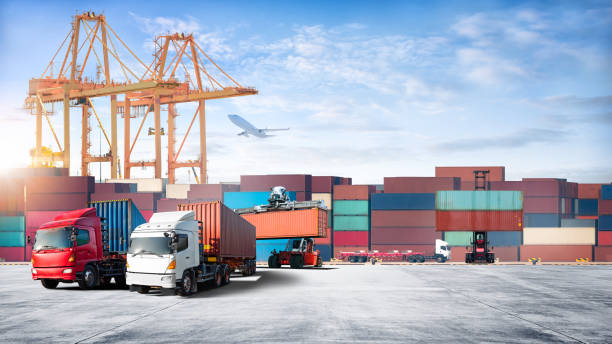 istock Container cargo freight ship during discharging at industrial port move to container yard by trucks, handlers, cargo plane, copy space, logistic import export background and transport industry concept 1398847507