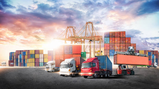 istock Business logistics and transportation concept of containers cargo freight ship and cargo plane with working crane in shipyard at sunset sky, logistic import export and transport industry background 1398847577