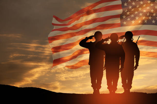 USA army soldiers saluting on a background of USA flag. Greeting card for Veterans Day, Memorial Day, Independence Day. USA army soldiers saluting on a background of sunset or sunrise and USA flag. Greeting card for Veterans Day, Memorial Day, Independence Day. America celebration. 3D-rendering. soldier stock pictures, royalty-free photos & images
