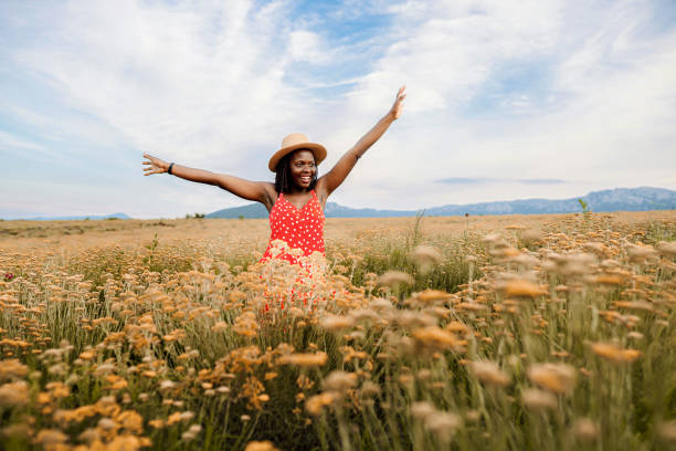 istock Happy black woman admiring nature 1398849785