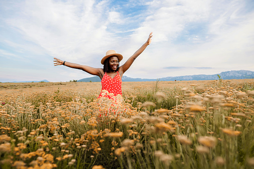Happy black woman admiring nature