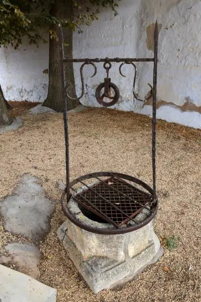 Photo of Well of stone and iron.