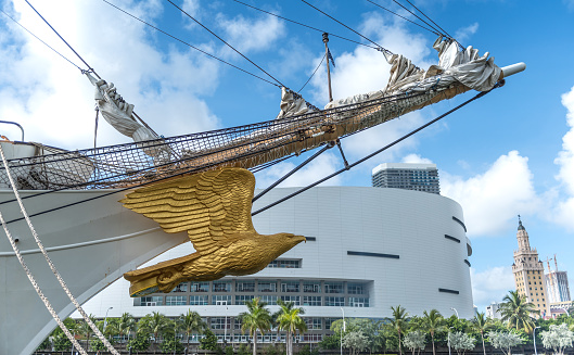 Miami, Florida, USA - May 23, 2022: View of US Coast Guard Eagle figurehead moored by Miami Downtown Miami. Former Germany sailboat Horst Wessel (1936), is a 295-foot (90 m) barque used as a training cutter for future officers of the United States Coast Guard.
