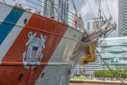 Miami, Florida, USA - May 23, 2022: View of US Coast Guard Eagle moored by Miami Downtown Miami. Former Germany sailboat Horst Wessel (1936), is a 295-foot (90 m) barque used as a training cutter for future officers of the United States Coast Guard.