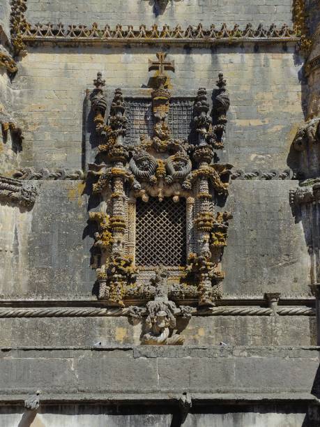 Iconic Manuelino and Baroque style Window of Convento de Cristo Tomar Beautiful front view of the Manueline and Baroque style window at the Convento de Cristo Tomar convento stock pictures, royalty-free photos & images