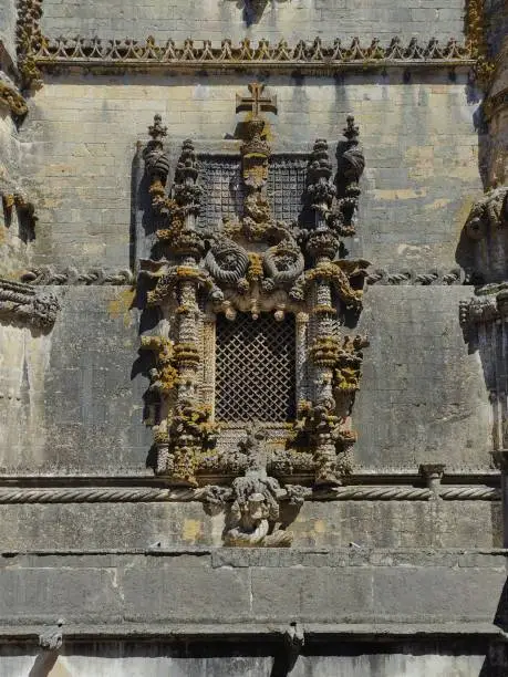 Beautiful front view of the Manueline and Baroque style window at the Convento de Cristo Tomar