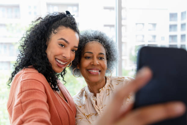 istock Mother and daughter take selfie 1398854654