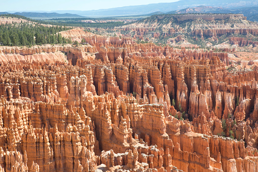 Pillars of red, white, and orange eroded rock formations.