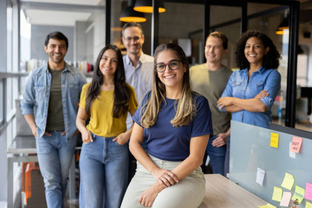 istock Happy group of workers smiling at the office 1398856638