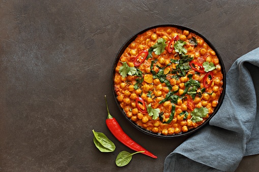 Spicy Chickpea and Spinach Curry. African chickpea stew. Flat layot