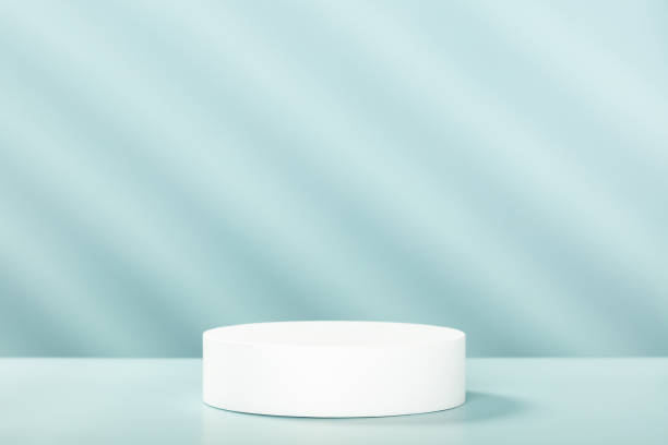 istock Abstract empty white podium with geometric shadows on blue background. Mock up stand for product presentation. 3D Render. Minimal concept 1398859610