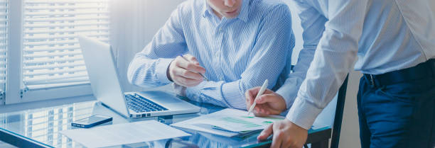 istock business people working in office, consulting 1398859922