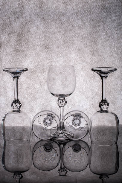 istock Still life with empty glass goblets on a gray background 1398860041