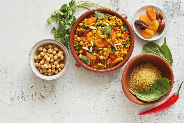 istock Vegan Moroccan Bulgur with Chick Peas, spinach, dried apricots and date fruit. 1398860096