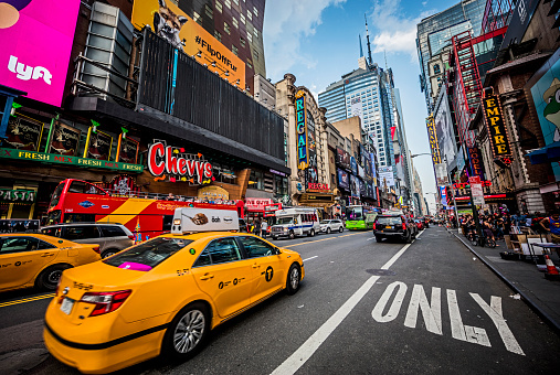 NEW YORK, USA - MAY 25, 2016: Taxis and traffic on a busy 42nd Street in New York City