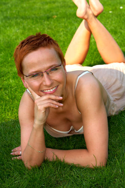 istock Woman relaxing in a park. 139886247