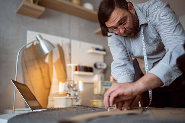 istock Male tailor outline with chalk, pattern on the textile 1398863318